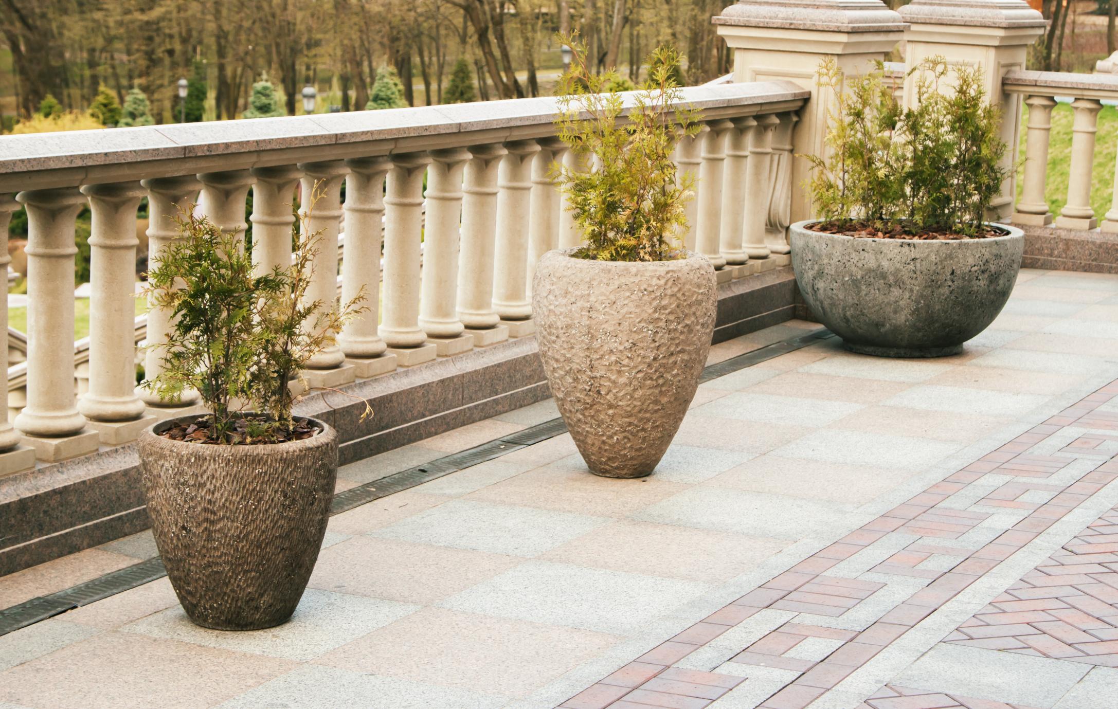 Pasadena Concrete Company - Decorative Concrete 1 a concrete veranda with plant vases
